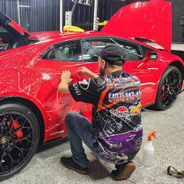 red lambo getting clear coat